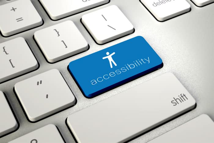 Kuvituskuva, jossa saavutettavuuden tunnuksella on oma painike näppäimistöllä